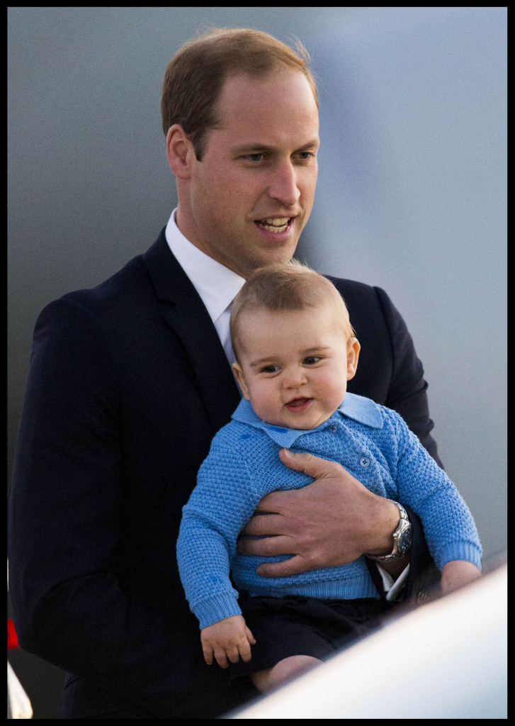 Prince William Suit Holds Prince George Blue Sweater