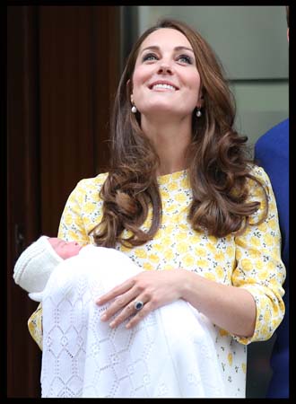 catherine looks up lindo wing holds princess charlotte