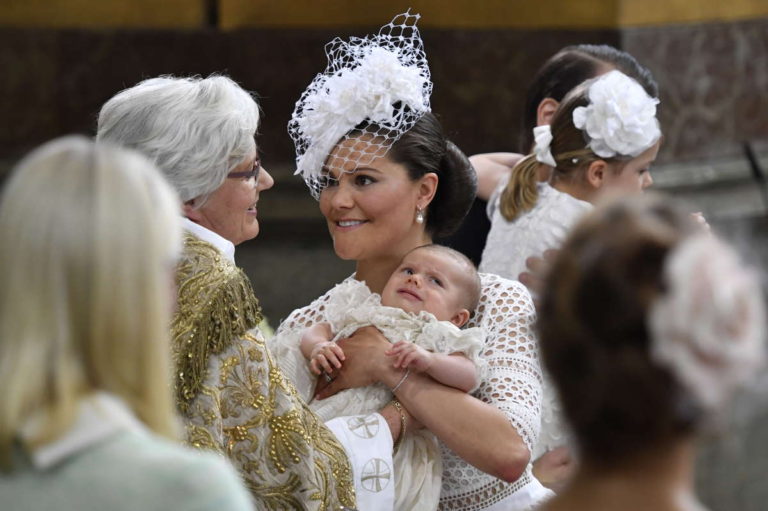 crown princess victoria hands over prince oscar swedish clergy woman