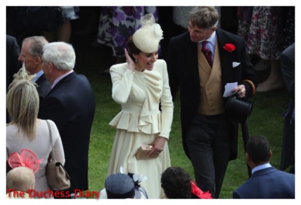 kate middleton fixes hair greets people buckingham palace garden party