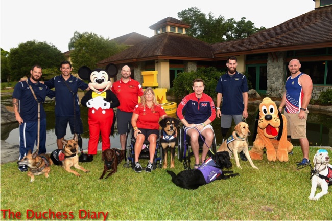 service dogs invictus games pose mickey mouse pluto owners