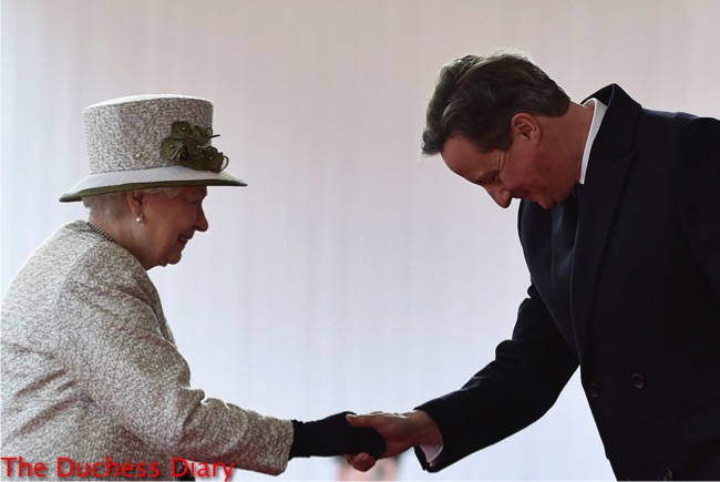 queen greets david cameron bows head
