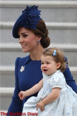 duchess cambridge carries princess charlotte smiling victoria airport tarmac